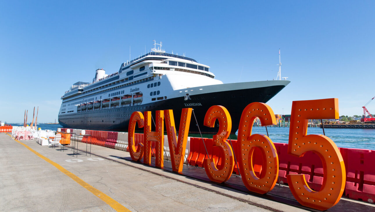 Cruise ship docked at a port with large orange "chv365" letters in the foreground, now a popular event venue space.