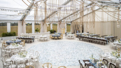 Wedding reception with custom nautical rope ceiling installation. Designed by JWennes Events.