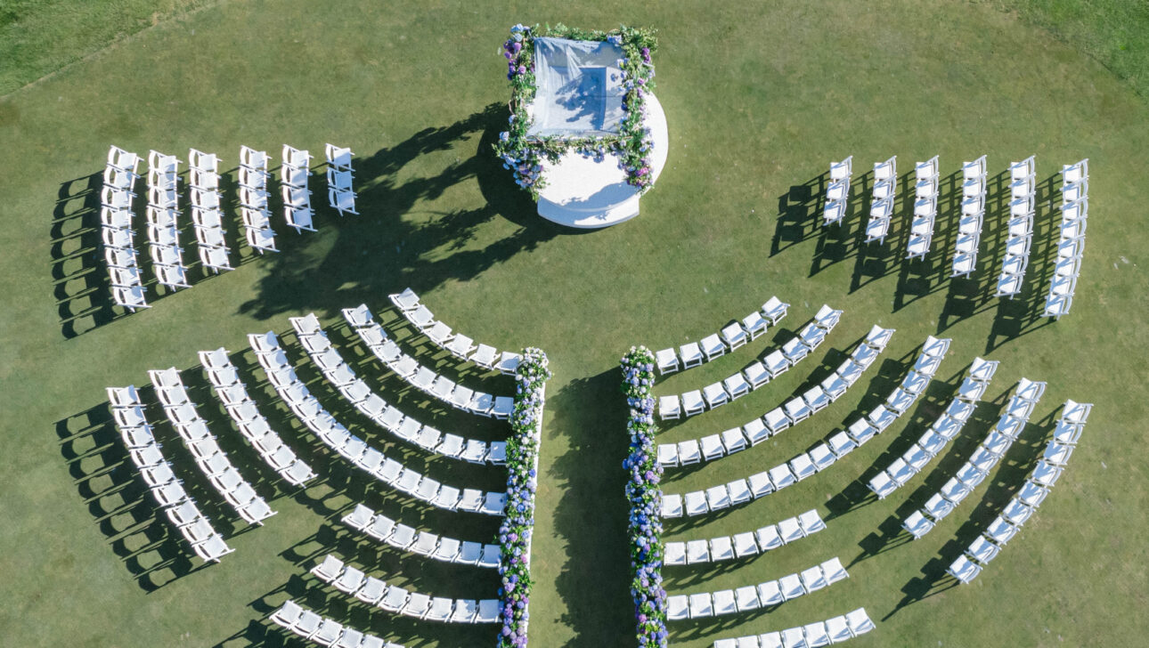 Outdoor wedding ceremony with chairs in circular pattern. Designed by JWennes Events.