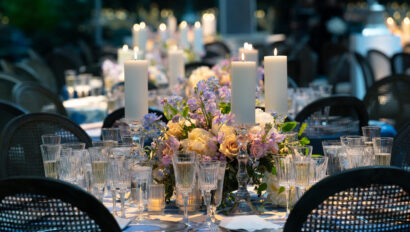 Wedding table scape with beautiful colorful florals. Designed by JWennes Events.