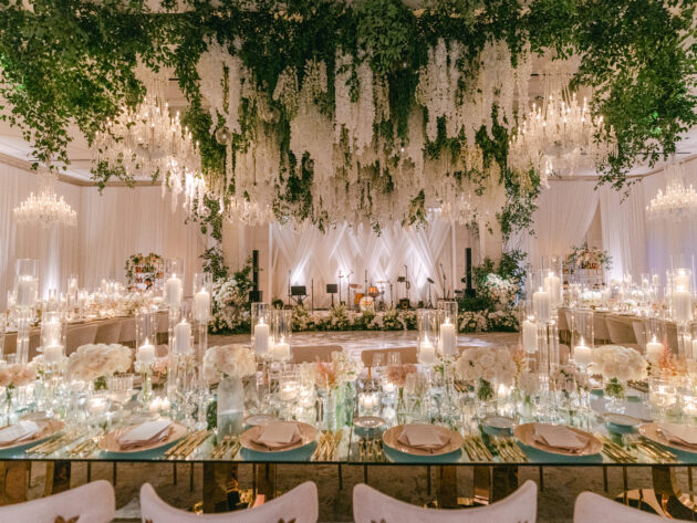 Dramatic wedding reception under a canopy of beautiful white florals. Designed by JWennes Events.